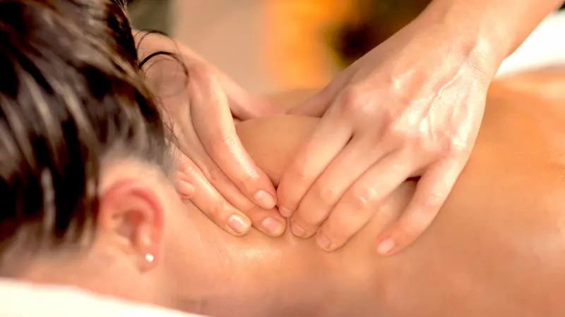 Massaging back of neck