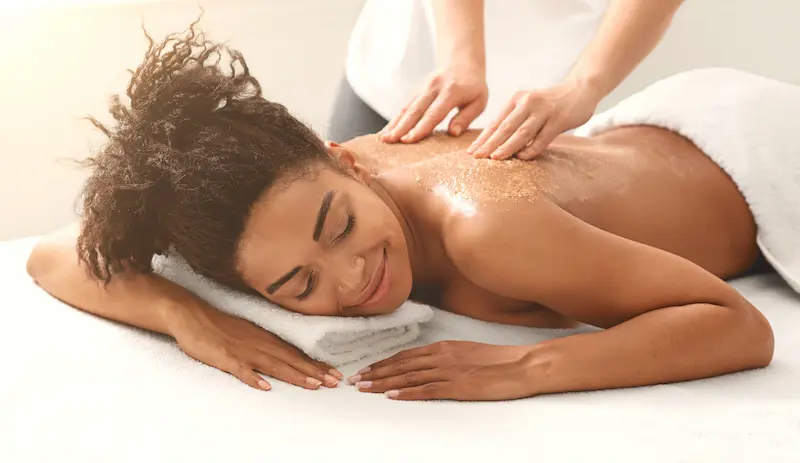 Woman laying down having a back massage