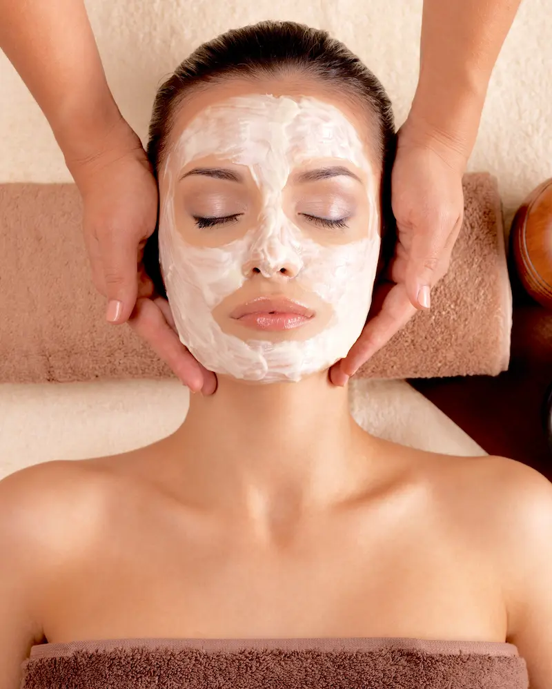 Woman receiving a facial treatment