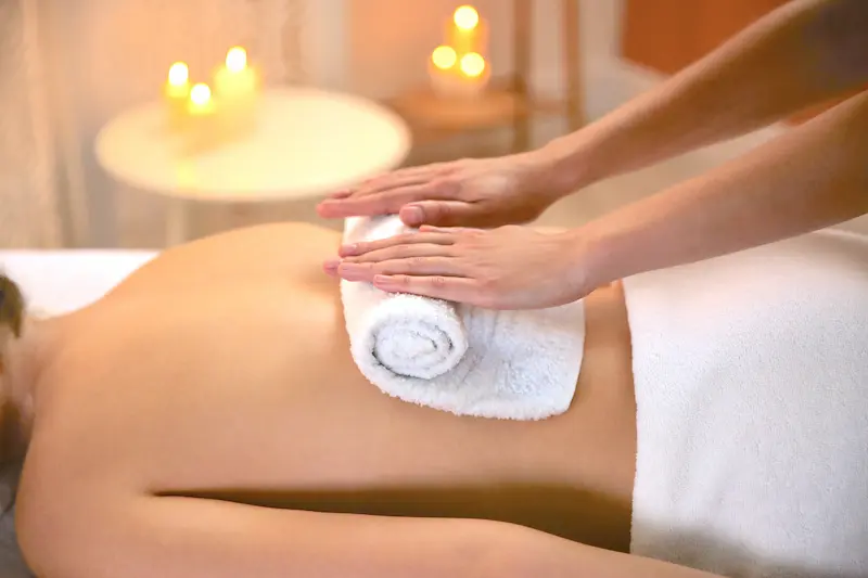 Towel rolled up on lower back